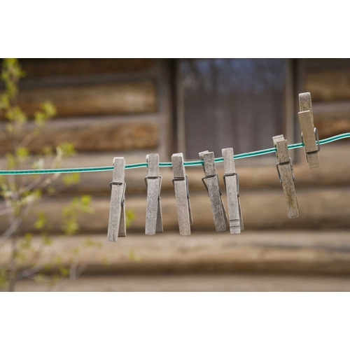 MT, Clothes pins on a clothesline by a log cabin